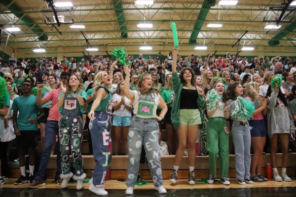 Members of the student section get loud during the Green Out pep rally.
