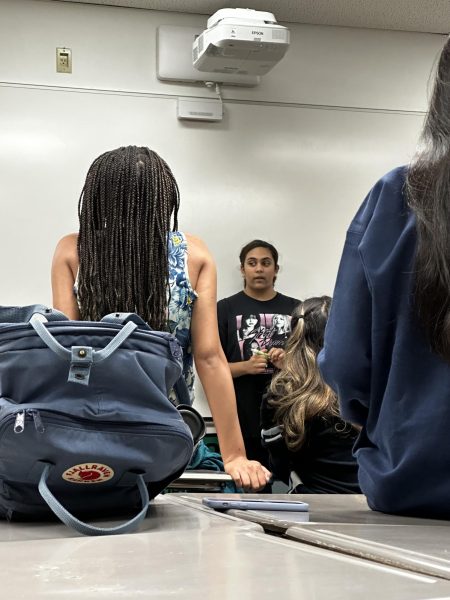 Uma Devarakonda talks to the speech and debate team 