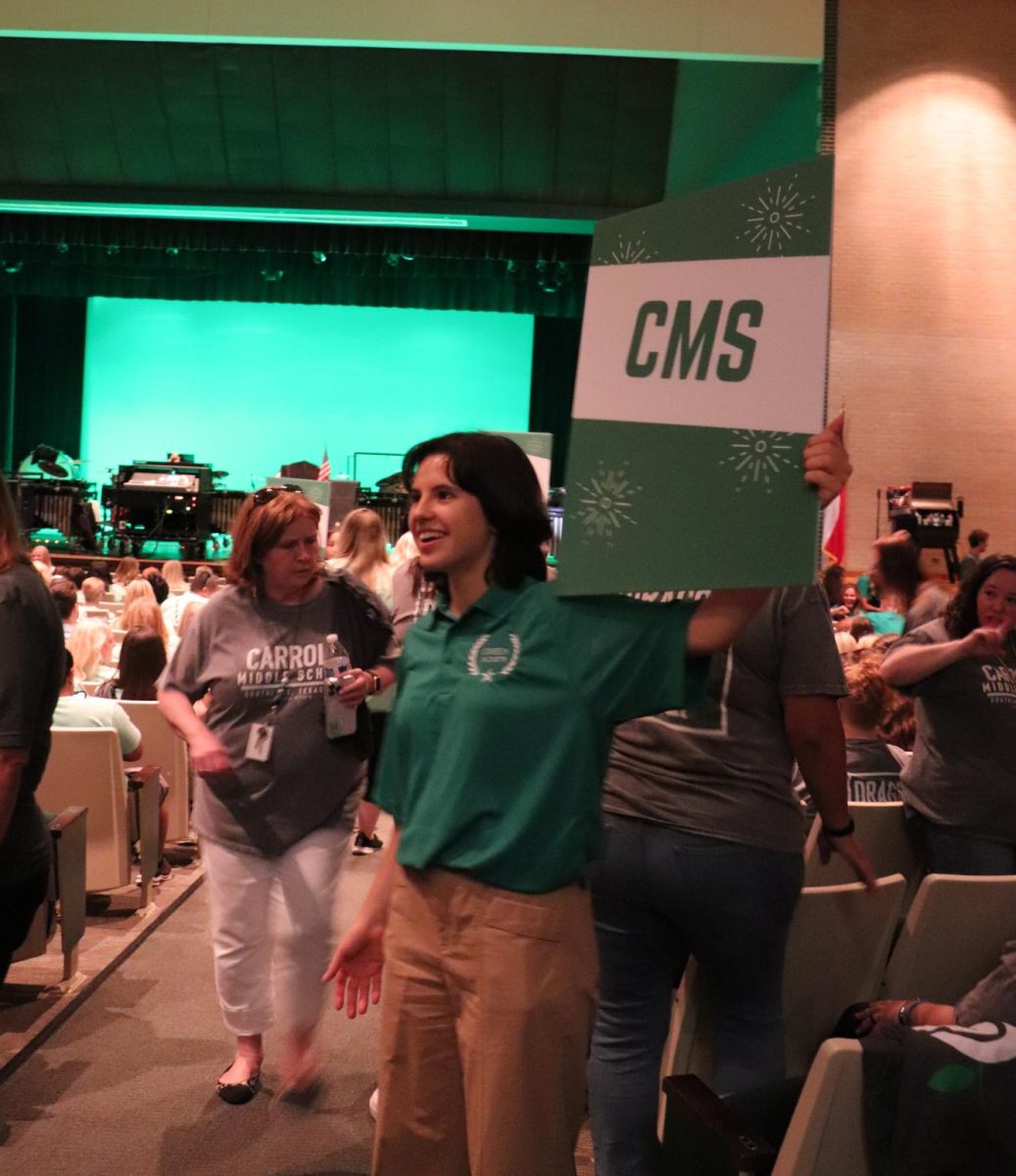 2023-24 Green Jacket member, Nicole Beres, helps to seat faculty and staff at the annual convocation in August. 