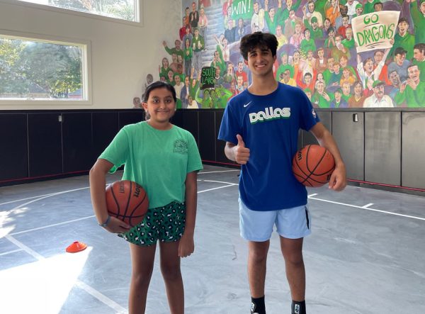 Sohum Kanabar poses with a young athlete following a basketball training session. Photo courtesy of S. Kanabar 