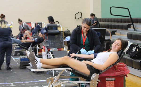 Sydney Rubin (12) donates blood during the fall drive.
