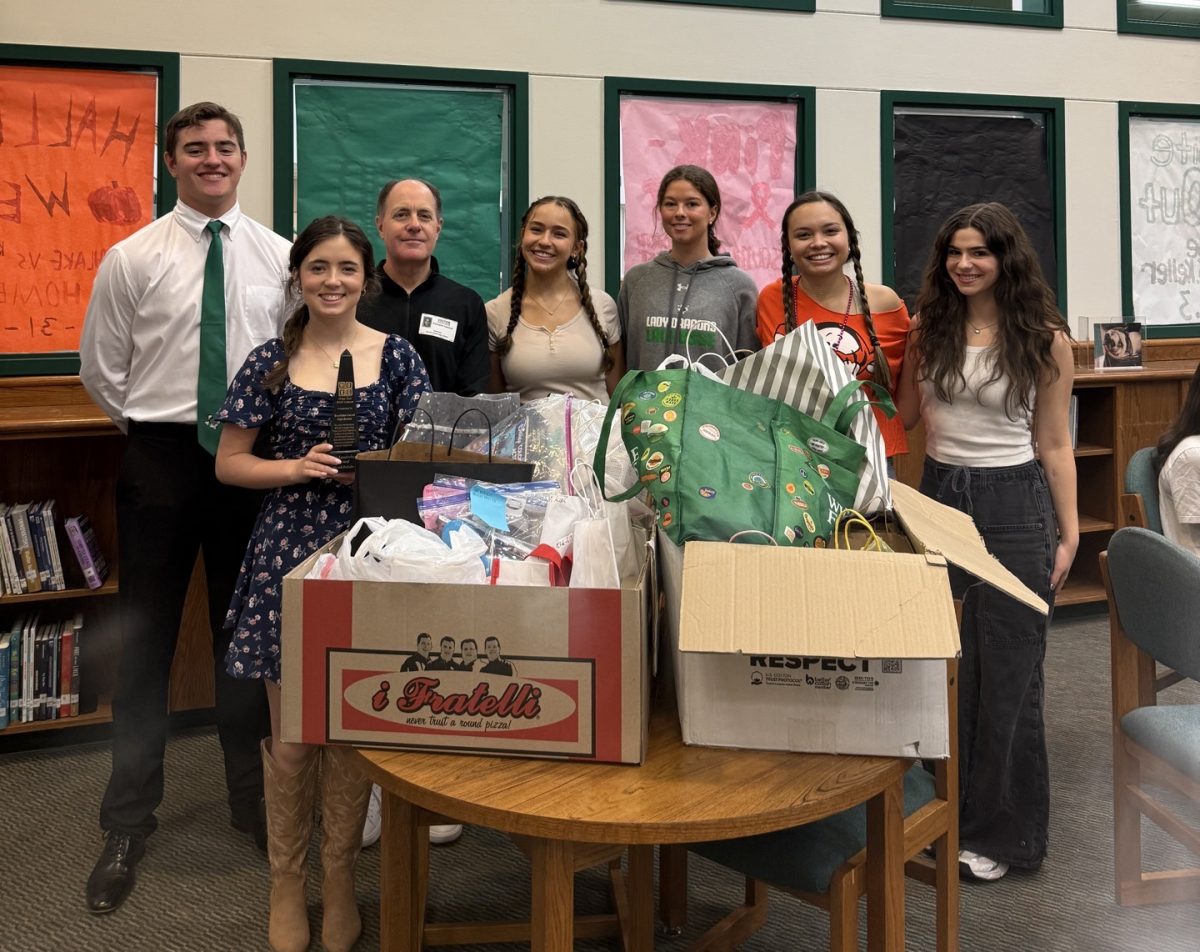 Student Council executive board receives the Luke Laufenbery Award for their work with WOKC.
