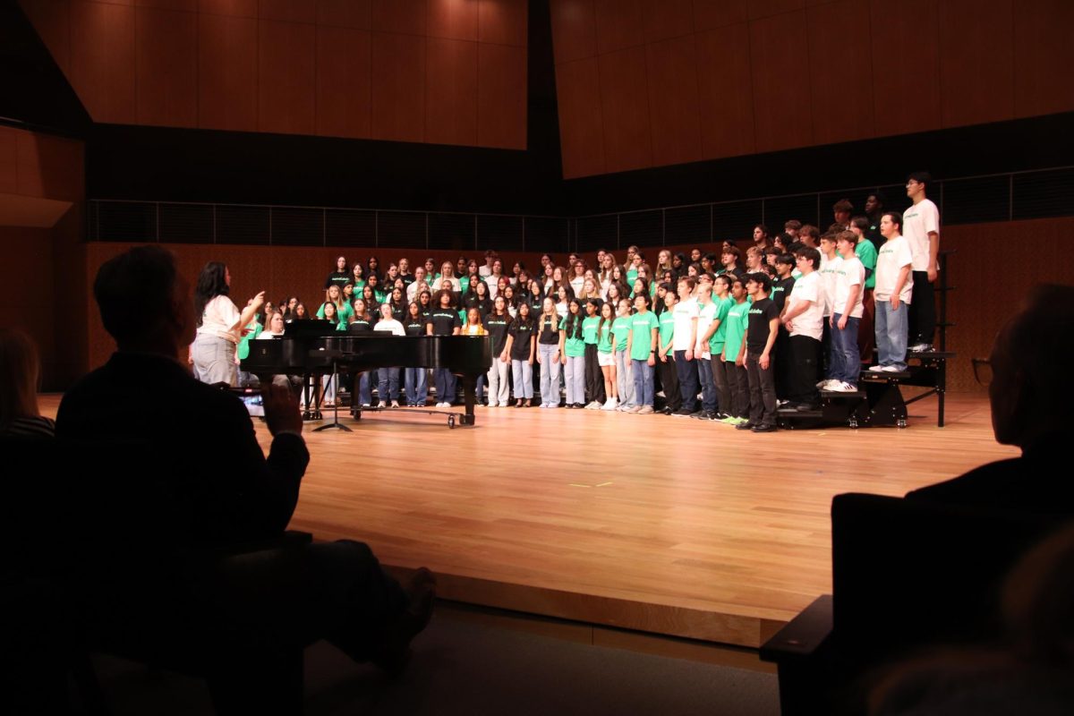 Ms. Casey LeVie leads The Southlake Chorale during the fall concert. 