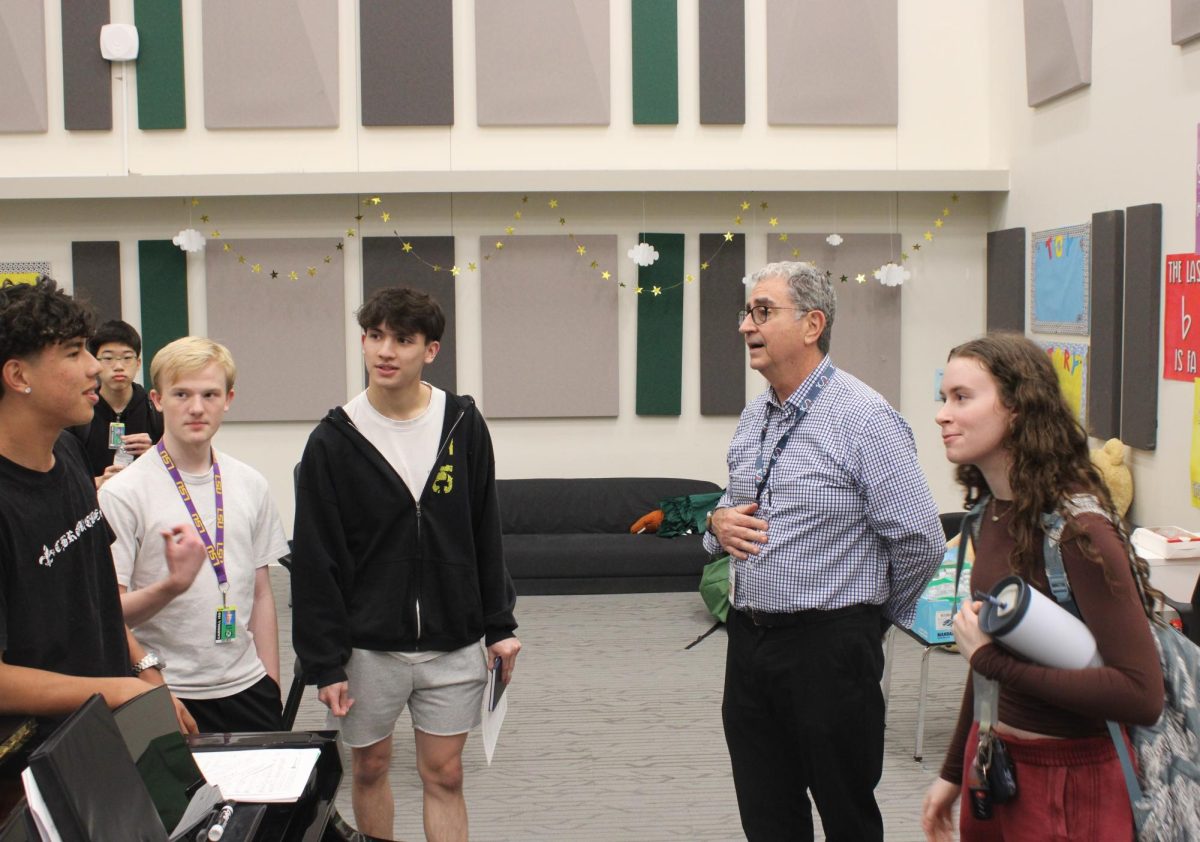 Mr. Mike Smith speaks to Aviation Club members during the Nov. 19 meeting. The club, sponsored by Ms. Casey LeVie, meets bi-monthly in the choir room. 